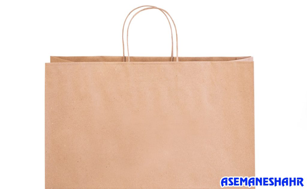 ساک دستی کرافت با دسته‌ های مقاوم، طراحی ساده و طبیعی | مناسب برای حمل هدایا و بسته‌ بندی محصولات سازگار با محیط زیست.
