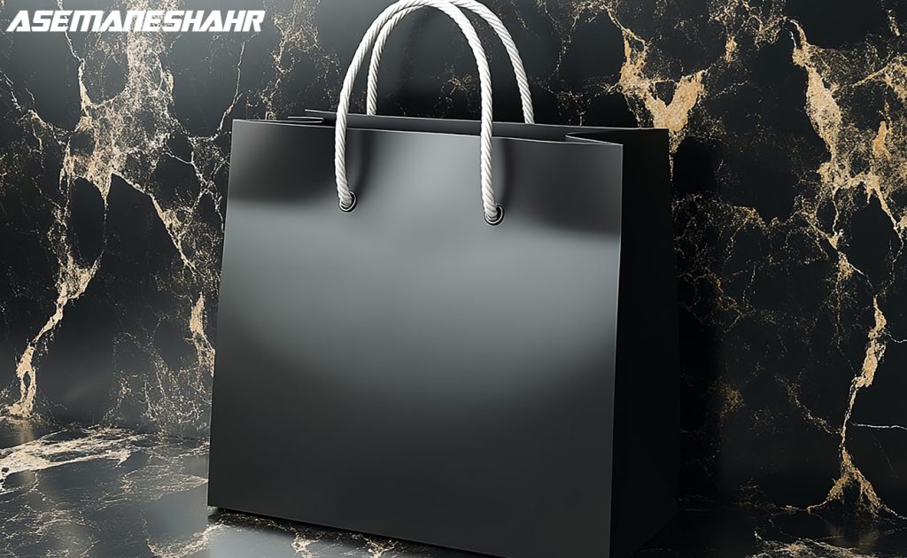 ساک هدیه مشکی لوکس، پس زمینه مرمر طلایی، شیک و مدرن.