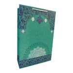 ساک دستی کاغذی با طرح فیروزه ای با نقوش سنتی و طراحی هنری.