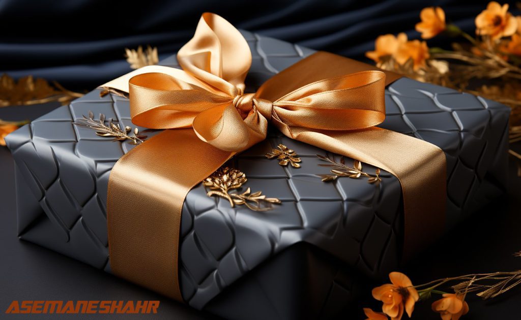 جعبه هدیه مشکی لوکس با روبان طلایی و تزیین گل.