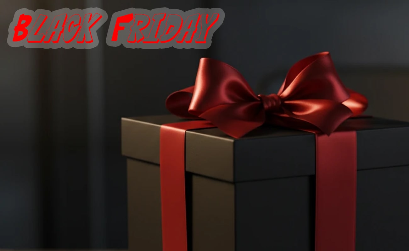 جعبه هدیه مشکی آسمان شهر با روبان ساتن قرمز براق در پس زمینه تیره برای جشن فروش ویژه بلک فرایدی.